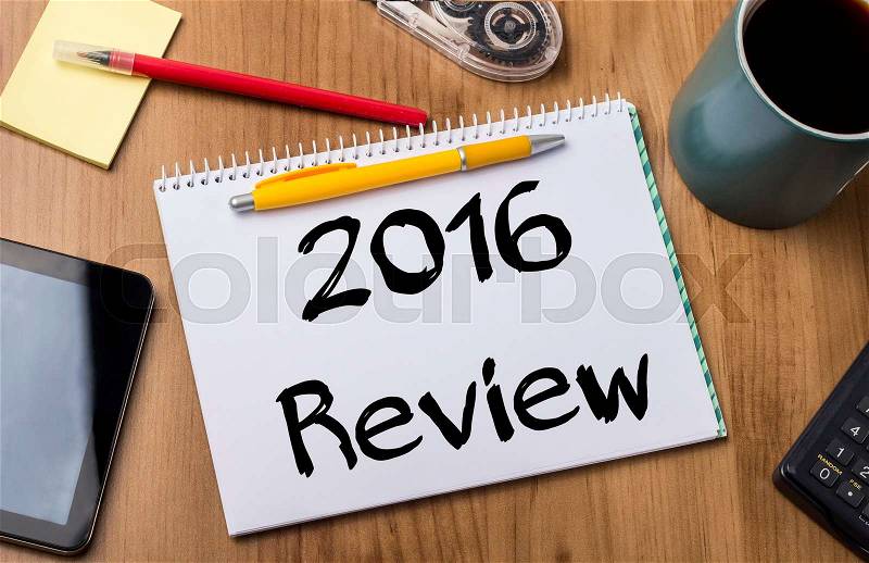 2016 Review - Note Pad With Text On Wooden Table - with office tools, stock photo