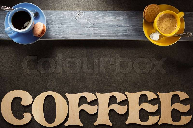Cup of coffee and tea on black background, stock photo