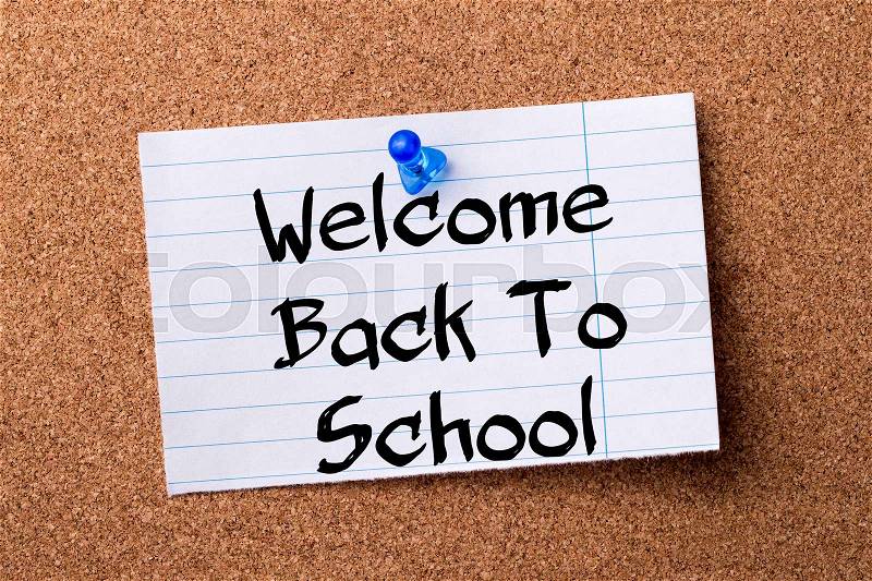 Welcome Back To School - teared note paper pinned on bulletin board - horizontal image, stock photo