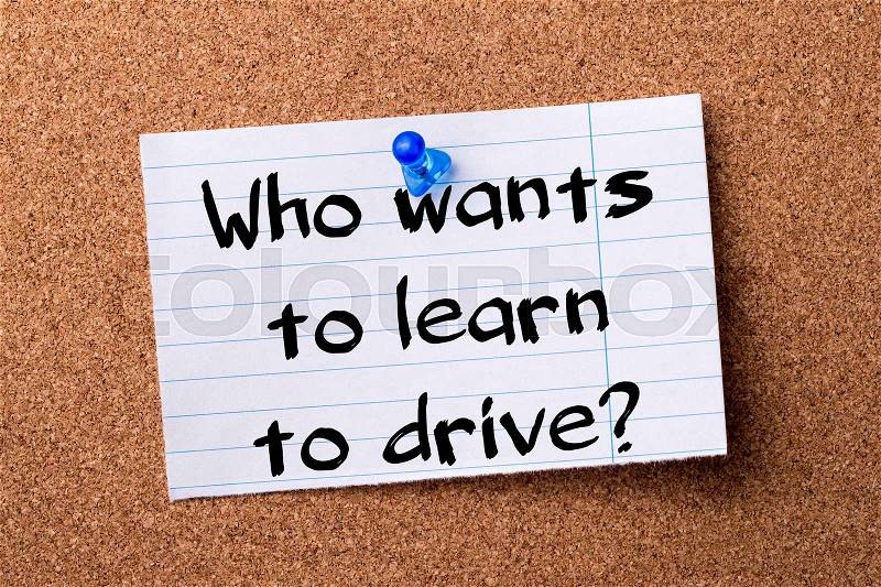 Who wants to learn to drive? - teared note paper pinned on bulletin board - horizontal image, stock photo