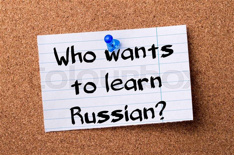 Who wants to learn Russian? - teared note paper pinned on bulletin board - horizontal image, stock photo