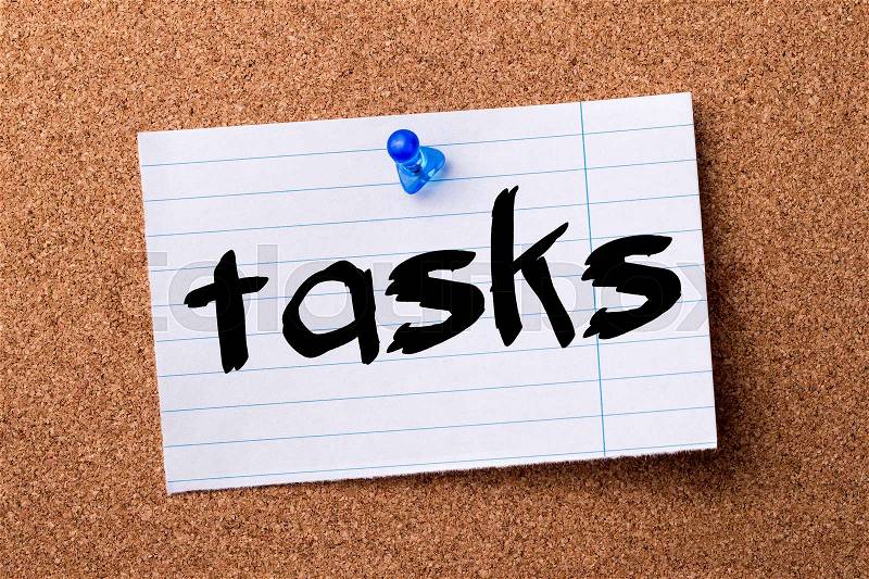 Tasks - teared note paper pinned on bulletin board - horizontal image, stock photo