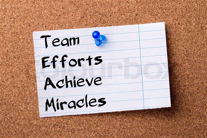 Team Efforts Achieve Miracles - teared note paper pinned on bulletin board - horizontal image, stock photo