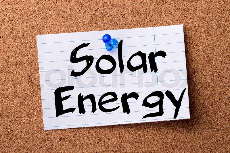 Solar energy - teared note paper pinned on bulletin board - horizontal image, stock photo