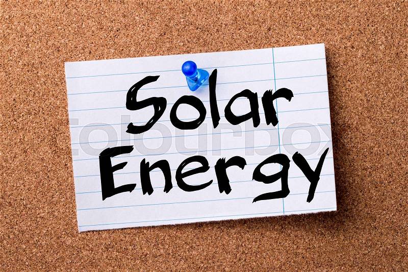 Solar Energy - teared note paper pinned on bulletin board - horizontal image, stock photo
