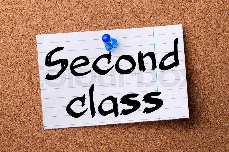 Second class - teared note paper pinned on bulletin board - horizontal image, stock photo