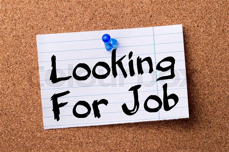 Looking For Job - teared note paper pinned on bulletin board - horizontal image, stock photo