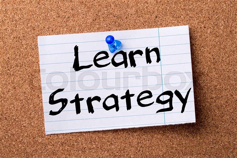 Learn Strategy - teared note paper pinned on bulletin board - horizontal image, stock photo