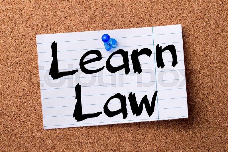 Learn Law - teared note paper pinned on bulletin board - horizontal image, stock photo