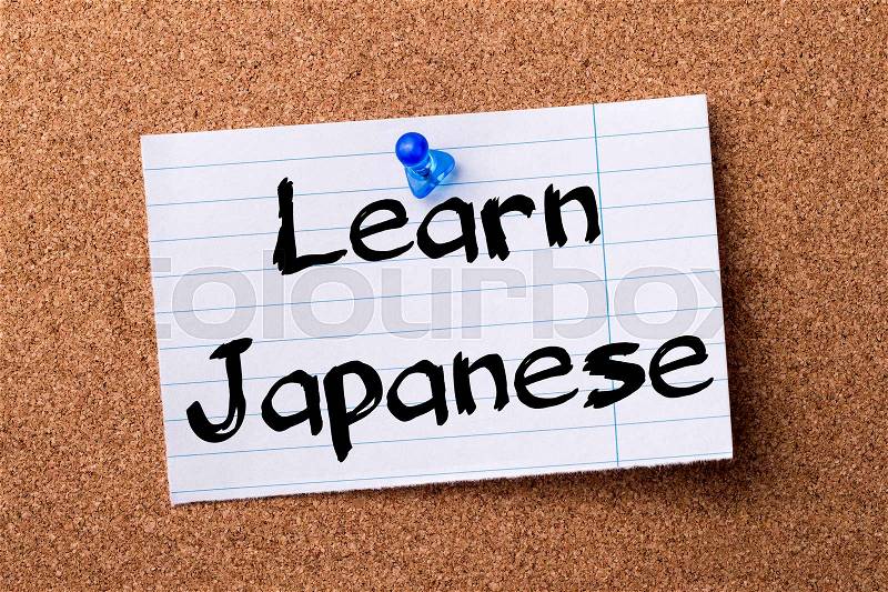 Learn Japanese - teared note paper pinned on bulletin board - horizontal image, stock photo
