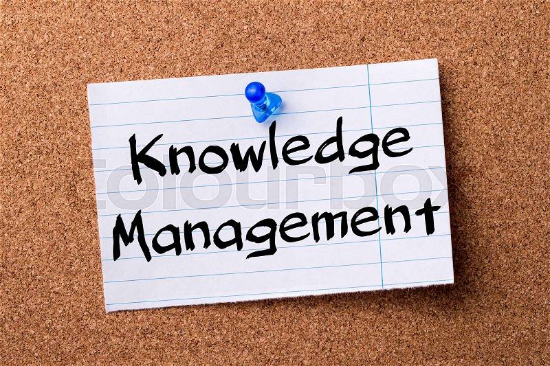 Knowledge Management - teared note paper pinned on bulletin board - horizontal image, stock photo