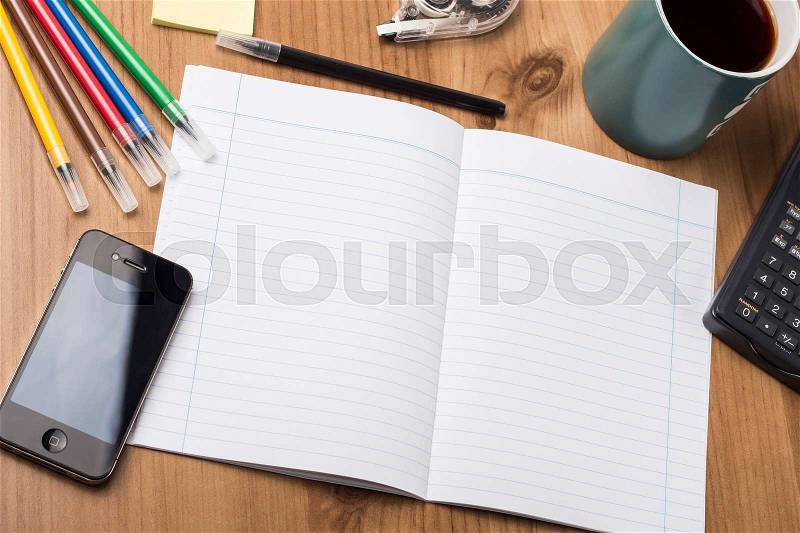 Empty Note Pad On Wooden Table - with office tools, stock photo