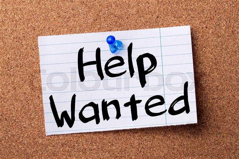 Help Wanted - teared note paper pinned on bulletin board - horizontal image, stock photo