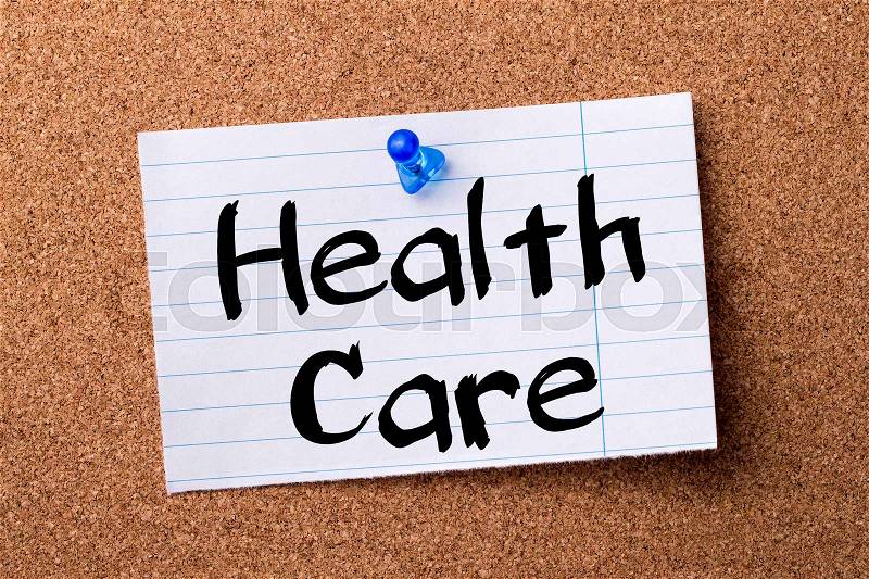 Health Care - teared note paper pinned on bulletin board - horizontal image, stock photo