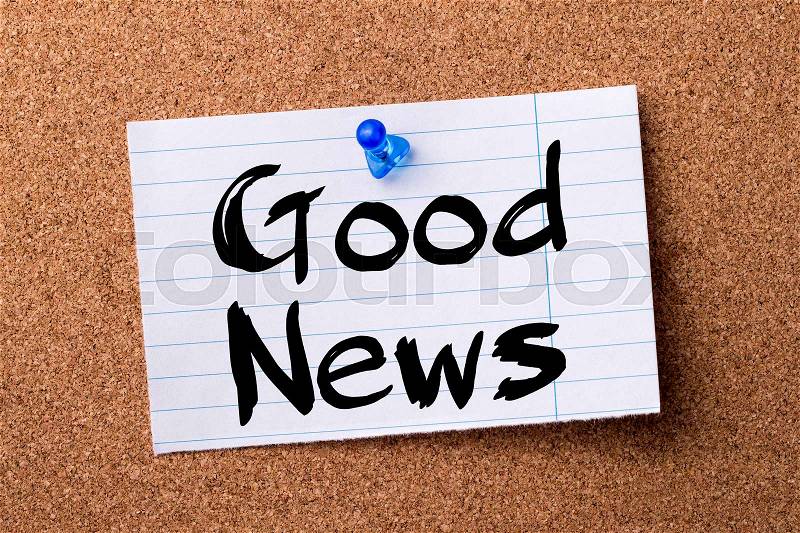 Good News - teared note paper pinned on bulletin board - horizontal image, stock photo