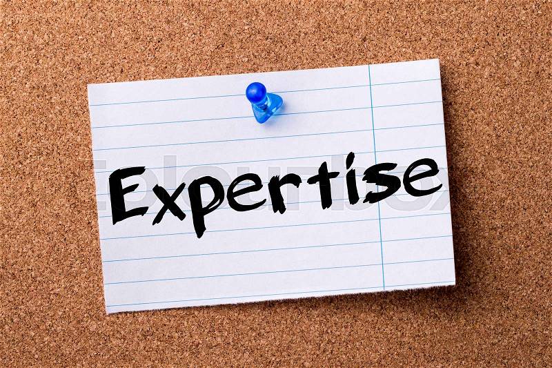 Expertise - teared note paper pinned on bulletin board - horizontal image, stock photo