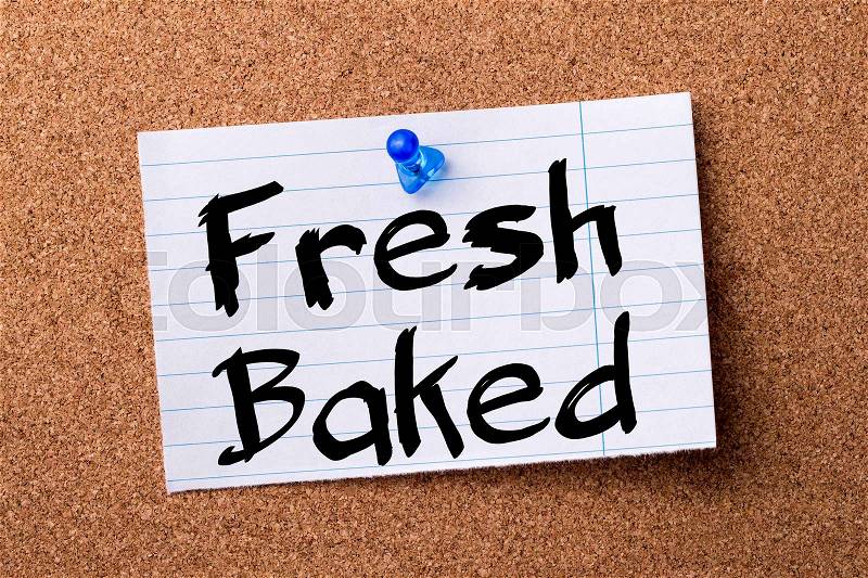 Fresh Baked - teared note paper pinned on bulletin board - horizontal image, stock photo