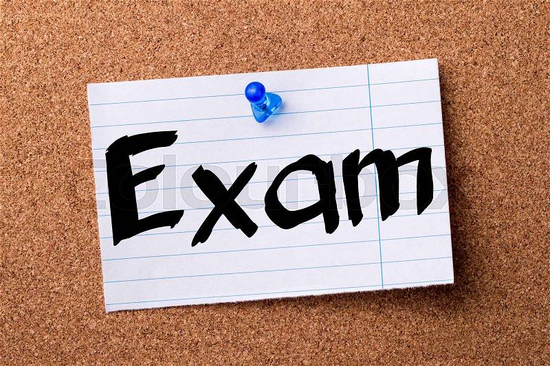 Exam - teared note paper pinned on bulletin board - horizontal image, stock photo