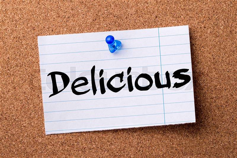 Delicious - teared note paper pinned on bulletin board - horizontal image, stock photo