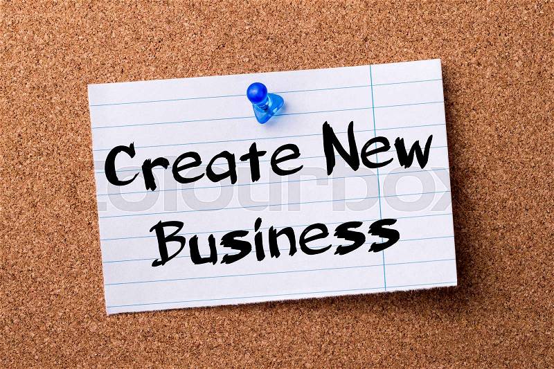 Create New Business - teared note paper pinned on bulletin board - horizontal image, stock photo