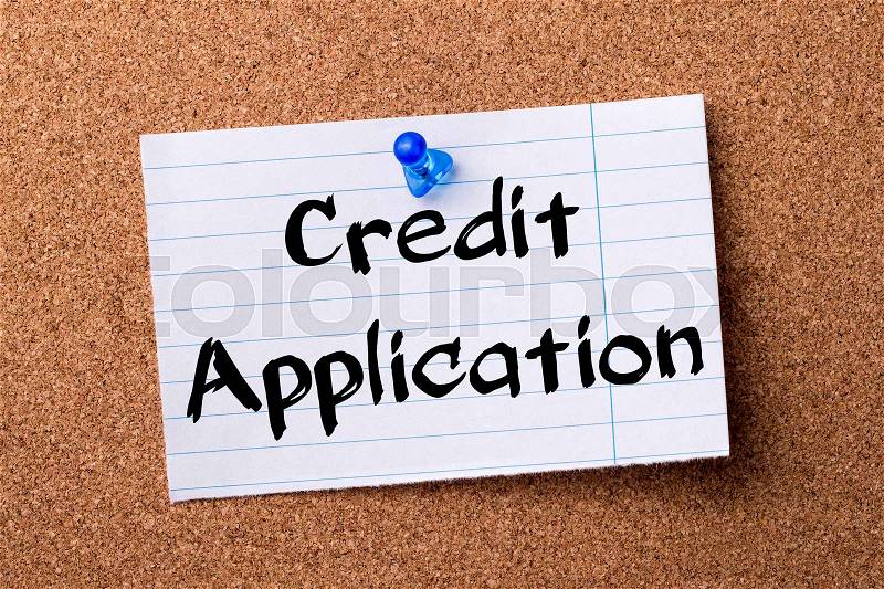 Credit Application - teared note paper pinned on bulletin board - horizontal image, stock photo