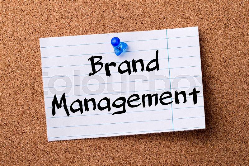 Brand Management - teared note paper pinned on bulletin board - horizontal image, stock photo