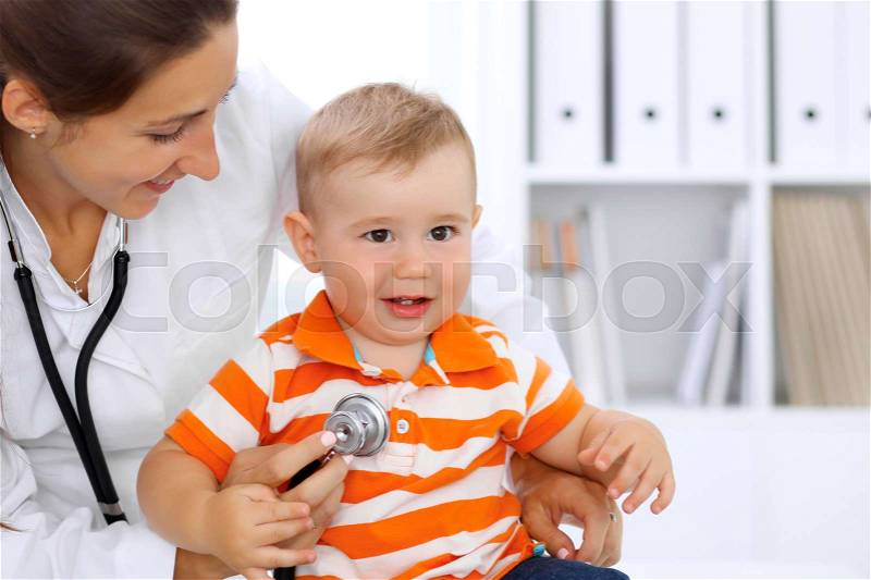 Little boy child at health exam at doctor's office, stock photo