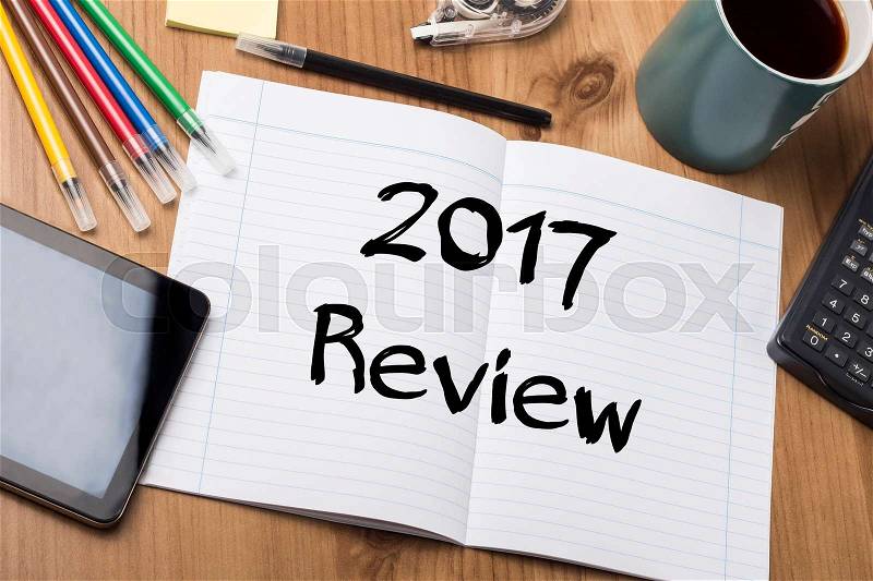 2017 Review - Note Pad With Text On Wooden Table - with office tools, stock photo