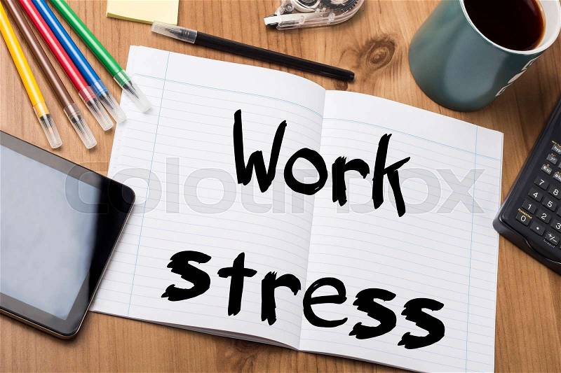 Work stress - Note Pad With Text On Wooden Table - with office tools, stock photo