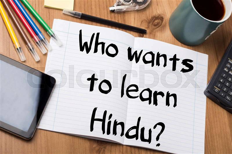 Who wants to learn Hindu? - Note Pad With Text On Wooden Table - with office tools, stock photo