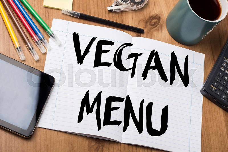 VEGAN MENU - Note Pad With Text On Wooden Table - with office tools, stock photo