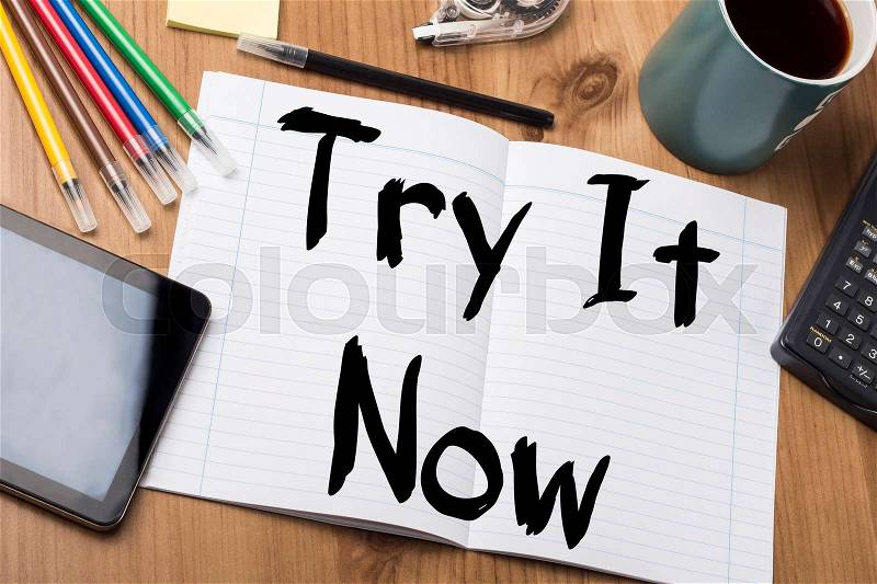 Try It Now - Note Pad With Text On Wooden Table - with office tools, stock photo