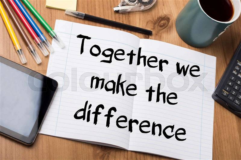 Together we make the difference - Note Pad With Text On Wooden Table - with office tools, stock photo