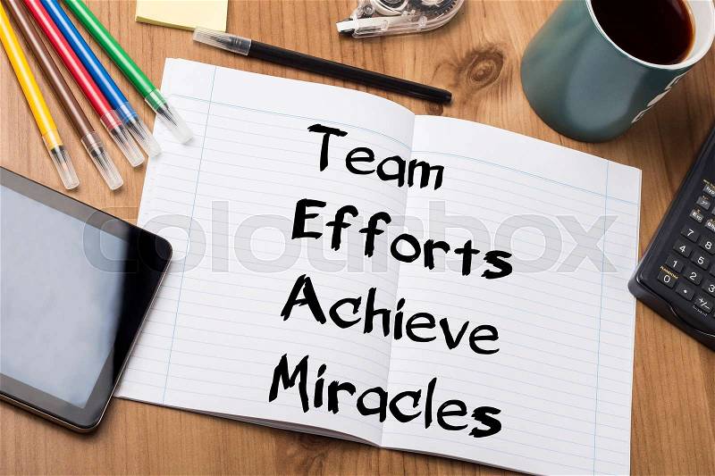 Team Efforts Achieve Miracles - Note Pad With Text On Wooden Table - with office tools, stock photo