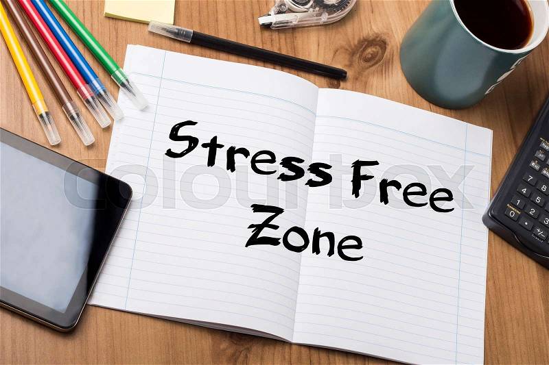 Stress Free Zone - Note Pad With Text On Wooden Table - with office tools, stock photo