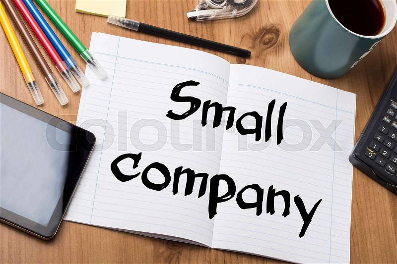 Small company - Note Pad With Text On Wooden Table - with office tools, stock photo