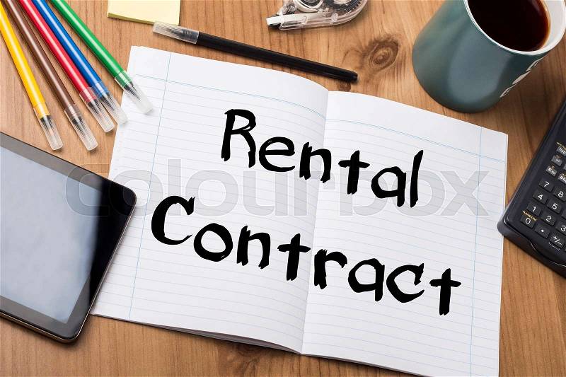 Rental Contract - Note Pad With Text On Wooden Table - with office tools, stock photo