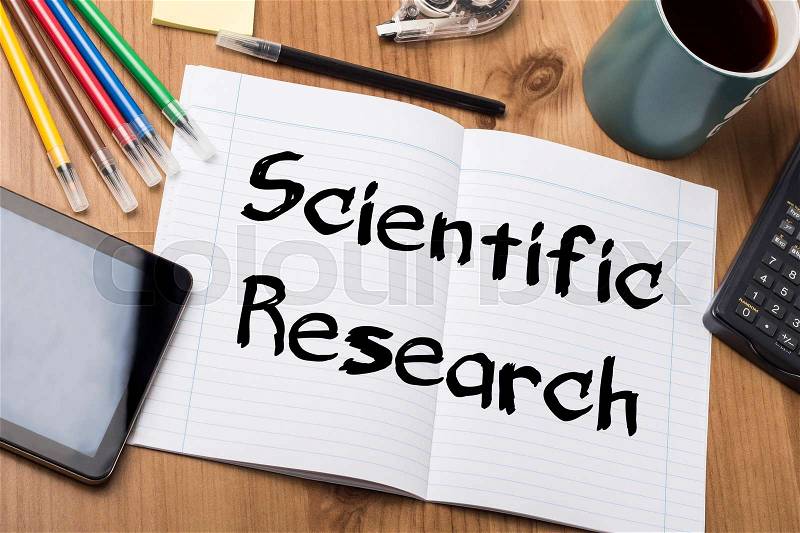 Scientific Research - Note Pad With Text On Wooden Table - with office tools, stock photo