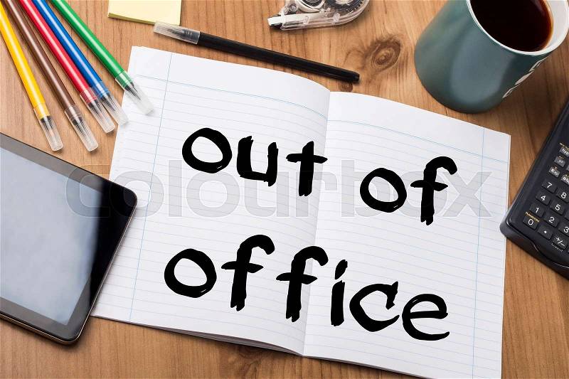 Out of office - Note Pad With Text On Wooden Table - with office tools, stock photo