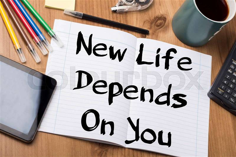 New Life Depends On You - Note Pad With Text On Wooden Table - with office tools, stock photo