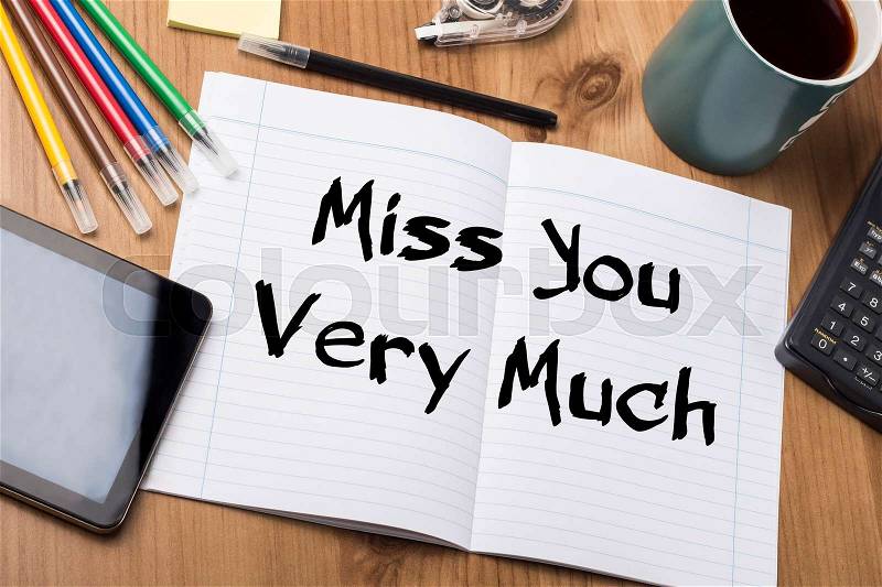 Miss You Very Much - Note Pad With Text On Wooden Table - with office tools, stock photo
