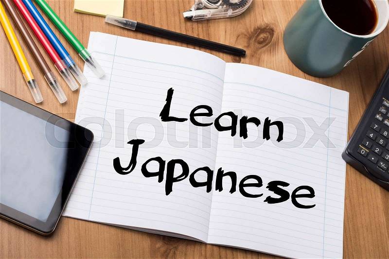 Learn Japanese - Note Pad With Text On Wooden Table - with office tools, stock photo