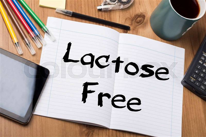 Lactose Free - Note Pad With Text On Wooden Table - with office tools, stock photo