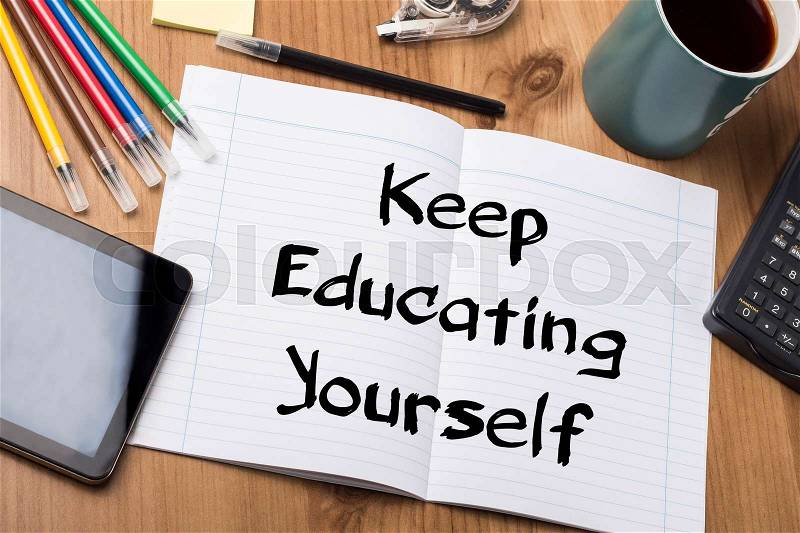 Keep Educating Yourself (KEY) - Note Pad With Text On Wooden Table - with office tools, stock photo