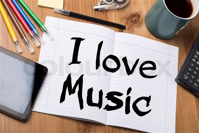 I love Music - Note Pad With Text On Wooden Table - with office tools, stock photo