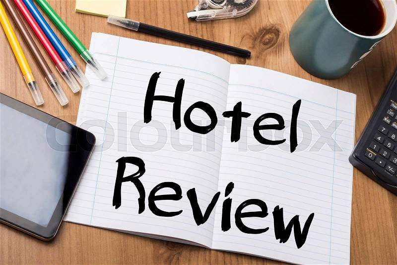 Hotel Review - Note Pad With Text On Wooden Table - with office tools, stock photo