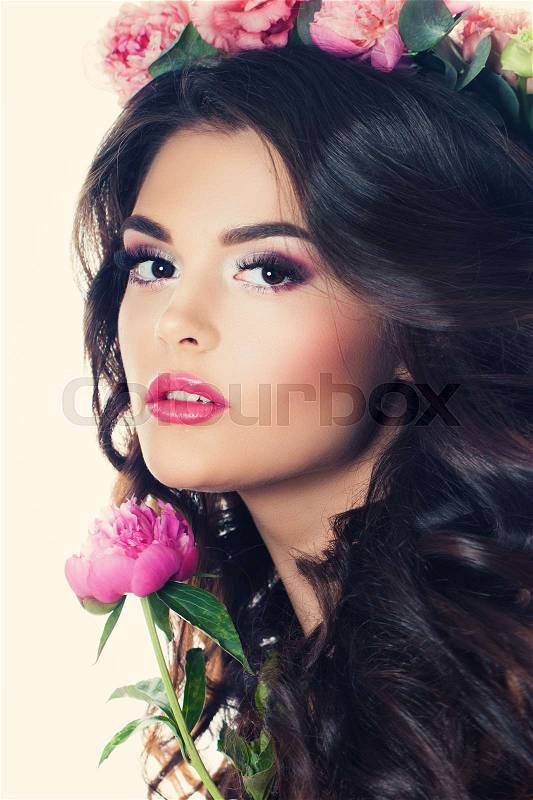 Brunette Woman with Summer Flowers, Makeup and Curly Hair. Fase Closeup, stock photo