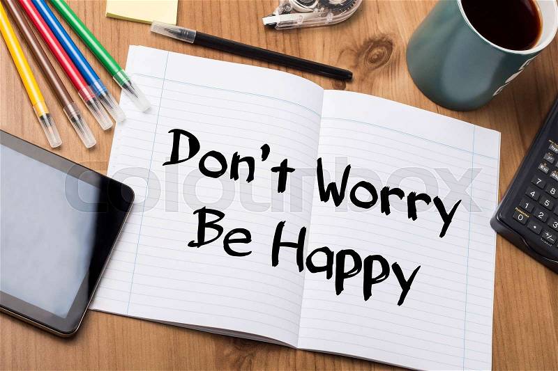 Don’t Worry Be Happy - Note Pad With Text On Wooden Table - with office tools, stock photo