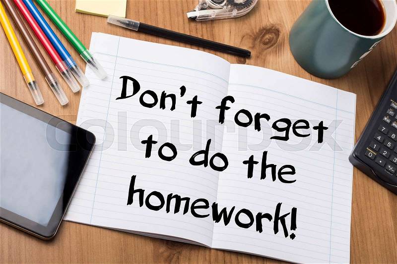 Don’t forget to do the homework! - Note Pad With Text On Wooden Table - with office tools, stock photo
