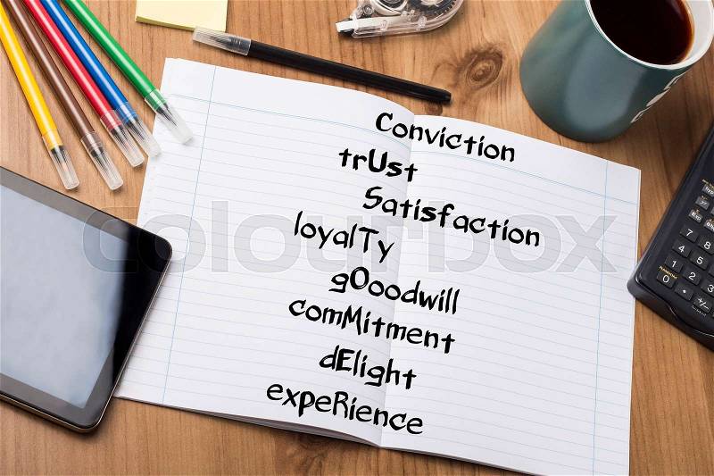 Conviction trUst Satisfaction loyalTy gOoodwill comMitment dElight expeRience CUSTOMER - Note Pad With Text On Wooden Table - with office tools, stock photo